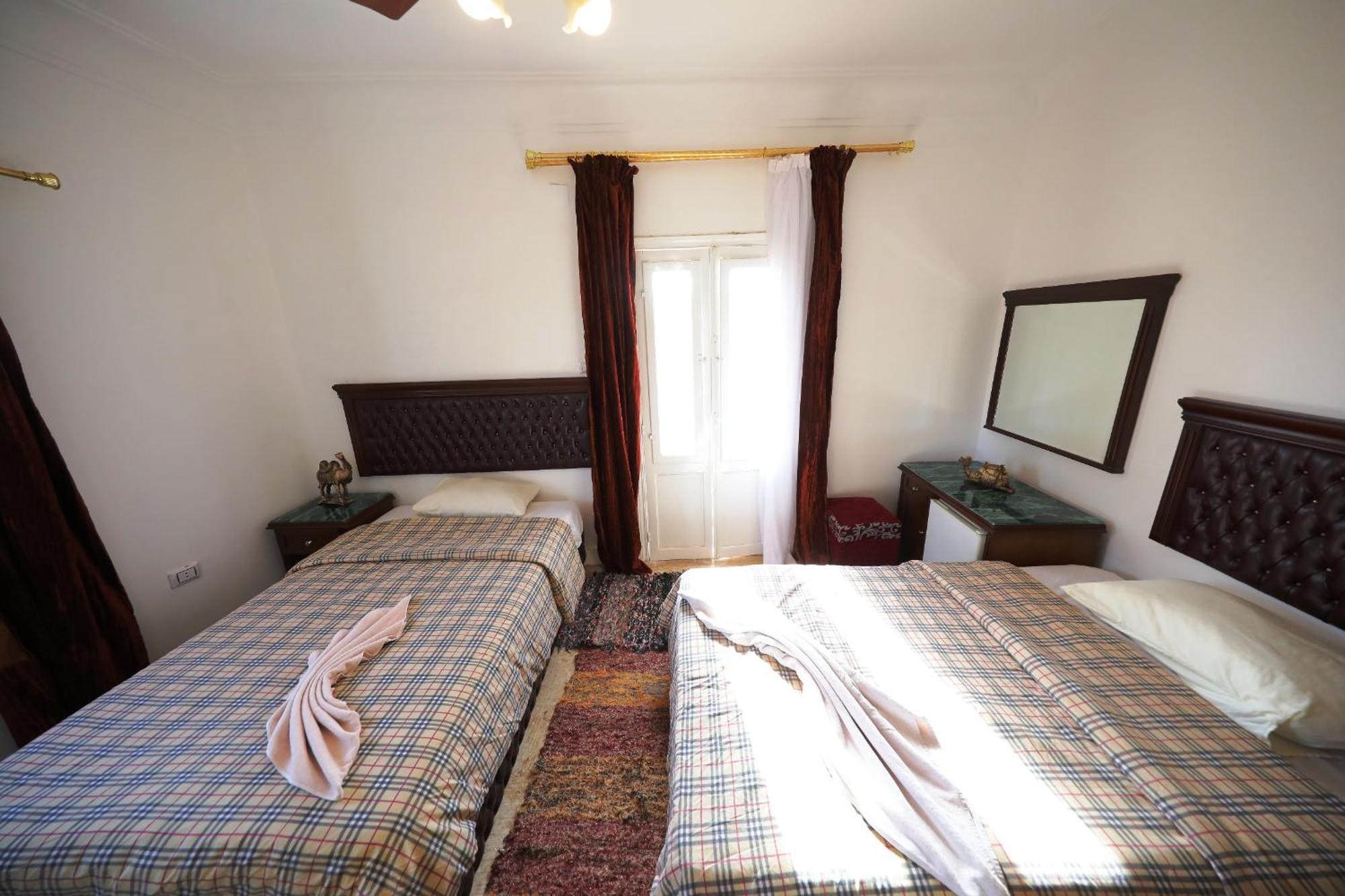 Pyramids Loft Guesthouse Cairo Quarto foto
