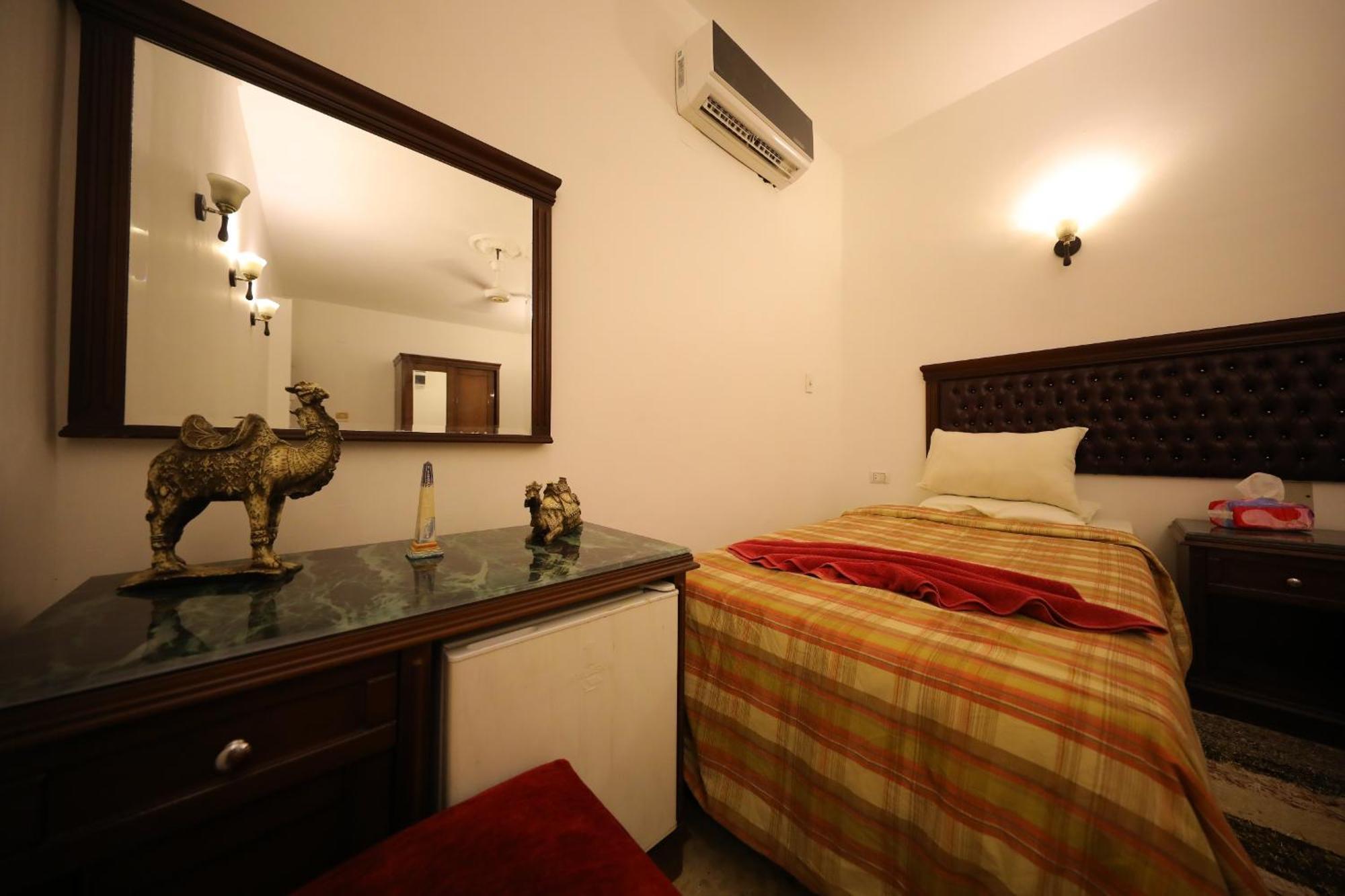 Pyramids Loft Guesthouse Cairo Quarto foto